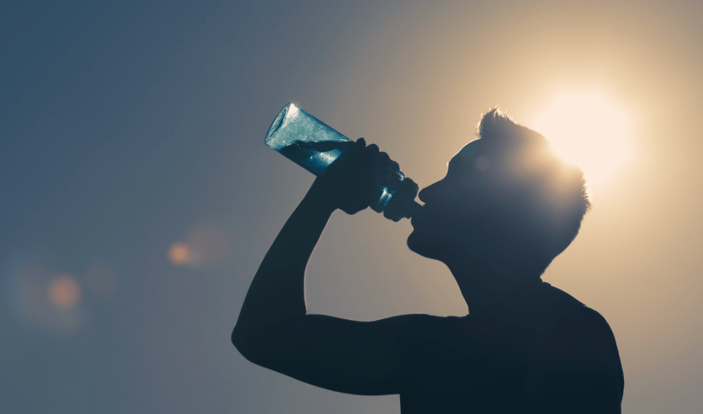 athlete hydrating with an electrolyte drink