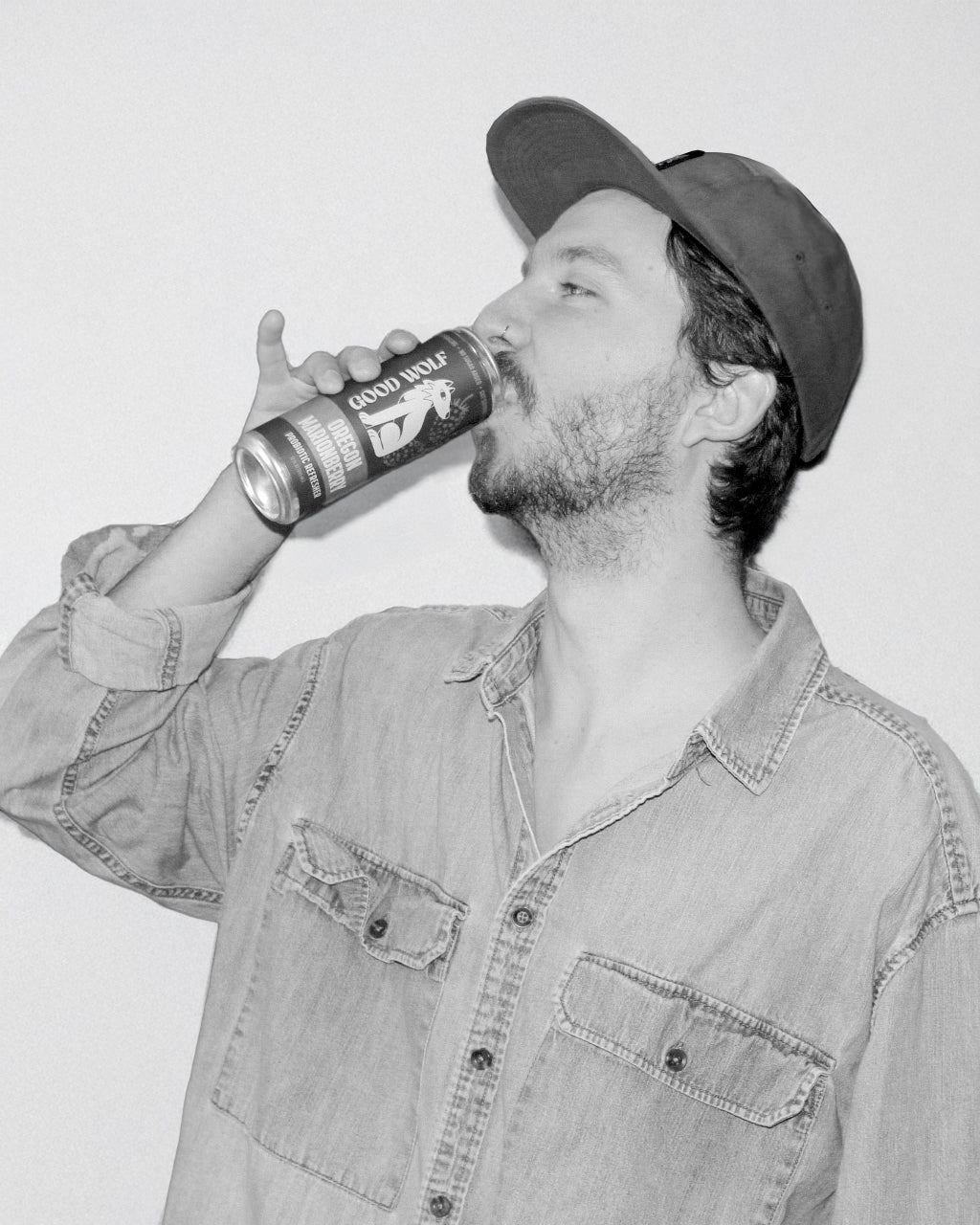 trevor_drinking_from_can_bw.jpg
