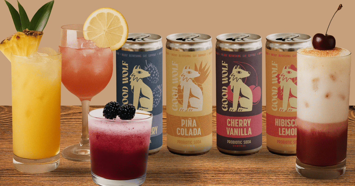 Colorful mocktails made with Good Wolf probiotic sodas in Berry, Piña Colada, Cherry Vanilla, and Hibiscus Lemonade flavors, shown with fresh fruit garnishes