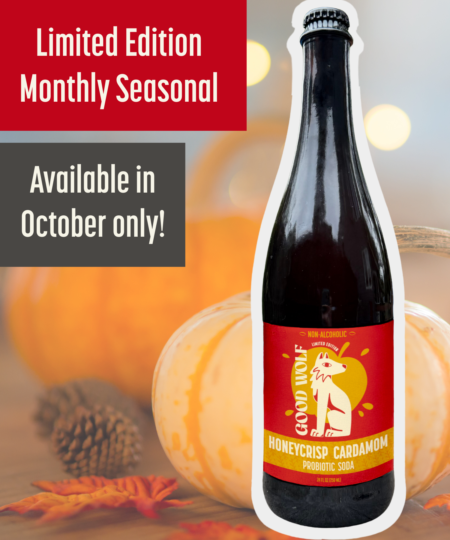 750ml glass Bottle of Good Wolf Honeycrisp Cardamom soda on a background of autumn leaves